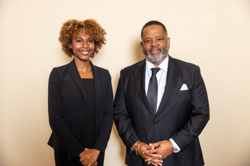 Attorney James L Walker Jr. Esq. with a member of the firm
