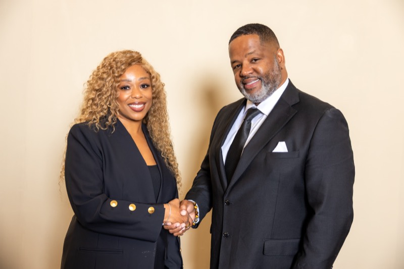 Attorney James L Walker Jr. Esq. greeting a colleague