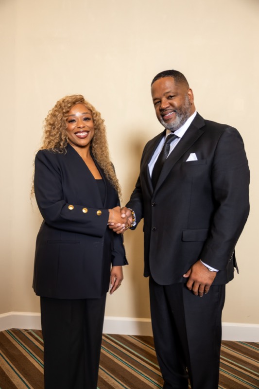 Attorney James L Walker Jr. Esq. greeting a colleague